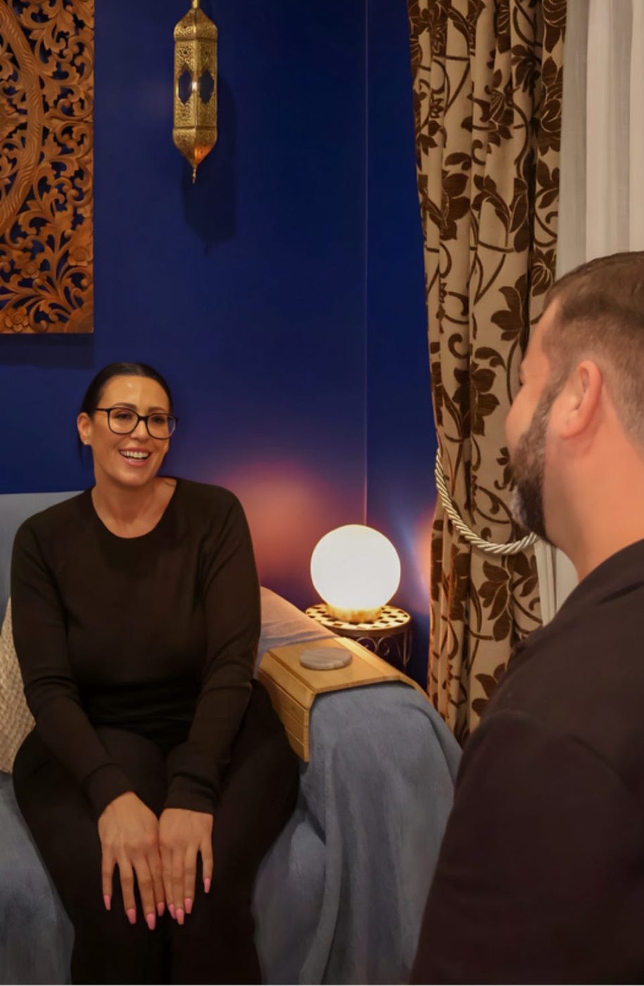 Mathew talking with a client before her session